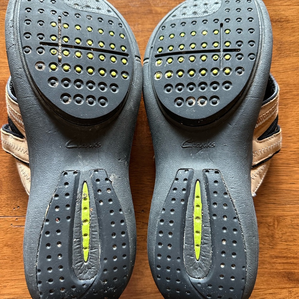 Women’s size 9.5 Clark sandals, brown in color.